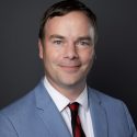 Headshot of Minister Spencer Chandra Herbert, presenting the awards at IMPACT 2025.